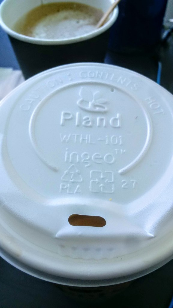 Peet’s Coffee – sustainability and social responsibility. A photo of a compostable coffee cup lid from Peet's Coffee is shown. The lid is made from poly-lactic acid by Ingeo. 