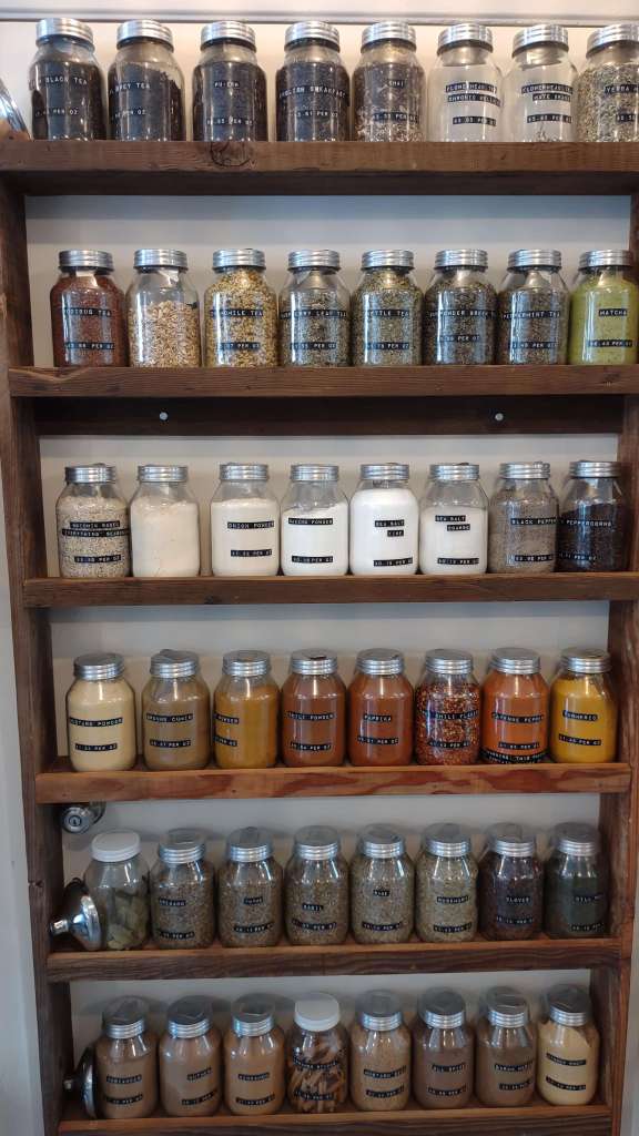 Re-Up Refill Shop, Oakland, California - jars of various herbs and spices are shown. The Re-Up Refill Shop offers zero-waste solutions for most of the stuff that you need for your home. 