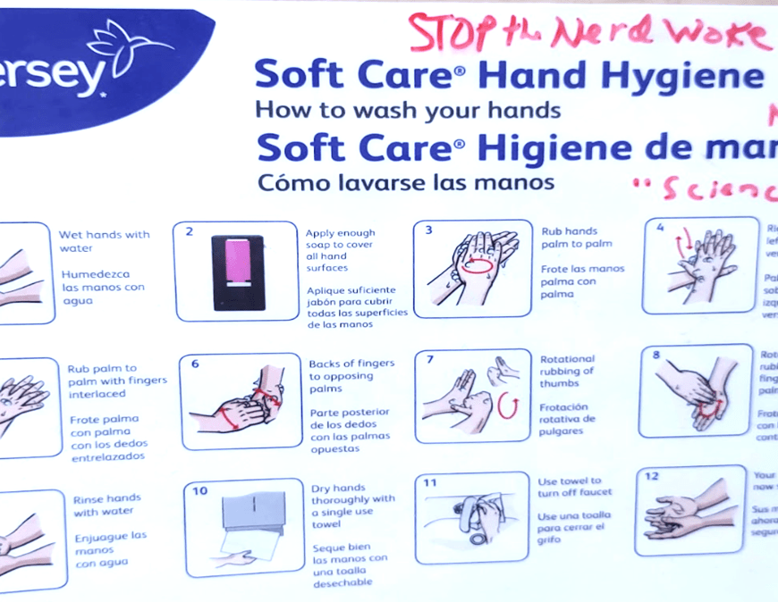 Graffiti on hand washing sign in red marker, reading: STOP the Nerd Woke Orders. Fake NWO. "Science"